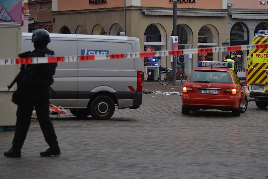 Police tape and police guard the scene of an incident in Trier, Germany.