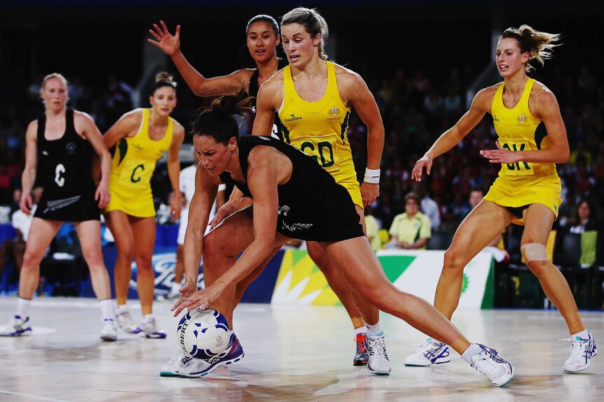 Julie Corletto puts the clamp on the Silver Ferns' Jodi Brown