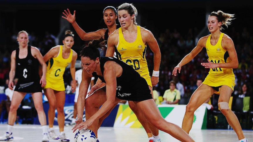 Julie Corletto puts the clamp on the Silver Ferns' Jodi Brown