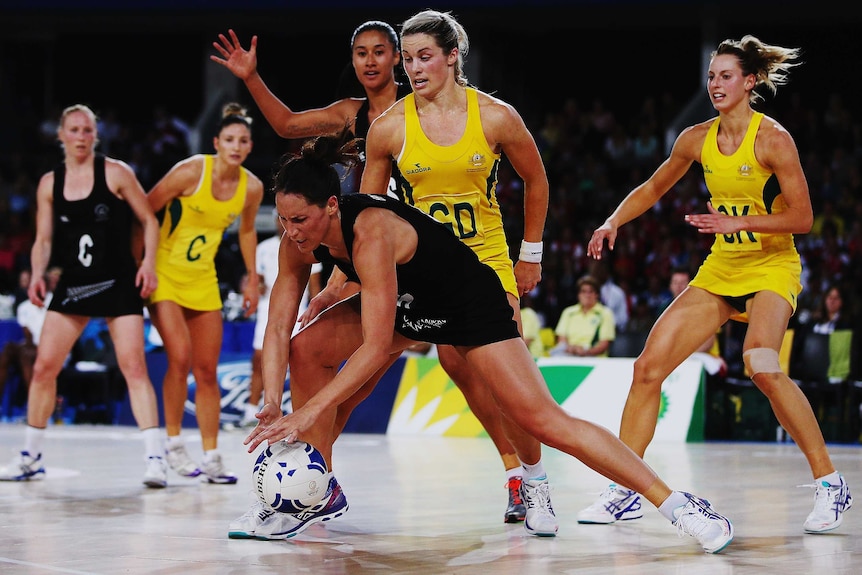 Julie Corletto puts the clamp on the Silver Ferns' Jodi Brown