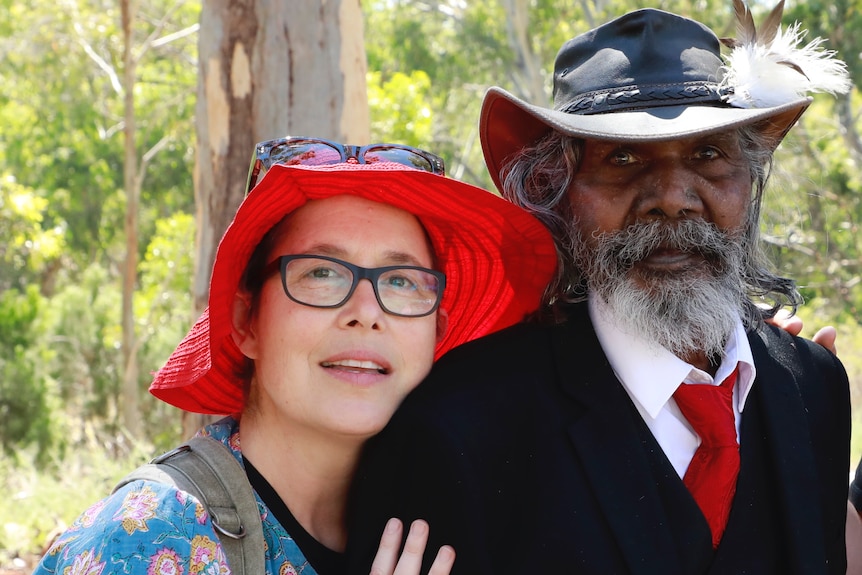 Filmmaker Molly Reynolds,  a white woman in red hat and glasses, and David Gulpilil, the Yolgnu actor and dancer in an akubra
