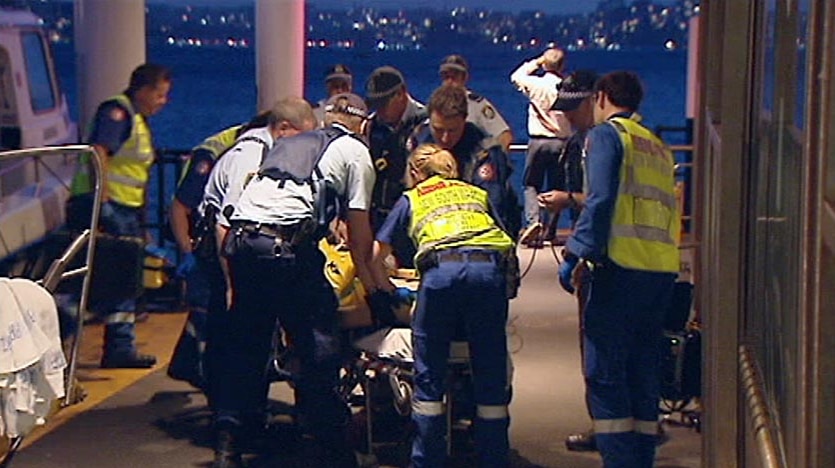 Paramedics and police move an 18-year-old man who was struck and killed by a 12-metre cruiser