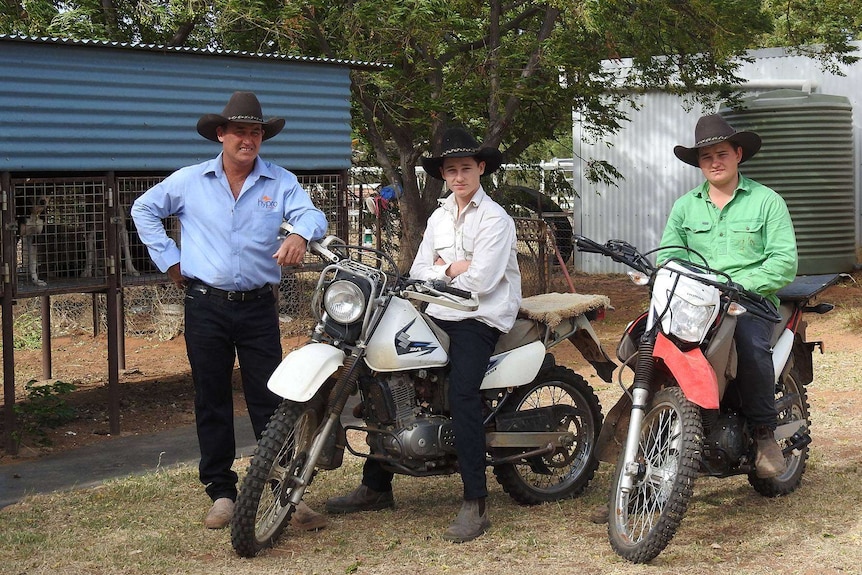 Mick Hudson and his twin boys Ben and Harry sitting on motorbikes