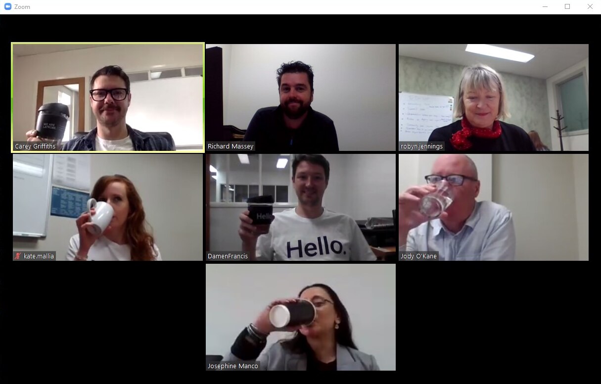 people having a coffee together via video conferencing