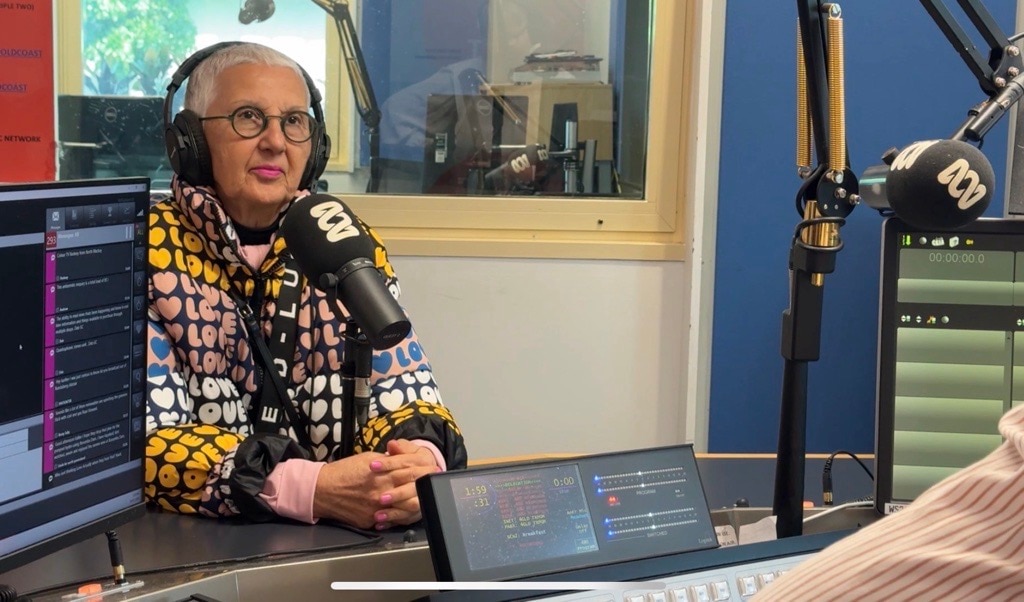 Woman with microphone in a radio studio