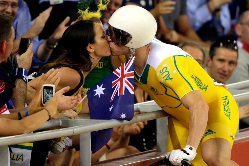 Shane Perkins kisses his wife after claiming bronze in the sprint finals.