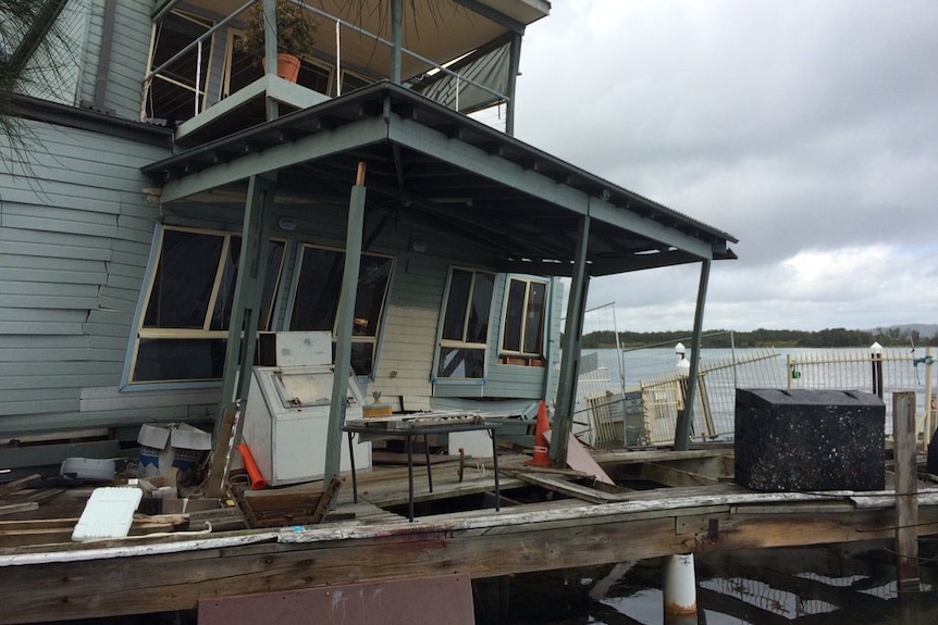 A marina building collapses into Lake Macquarie
