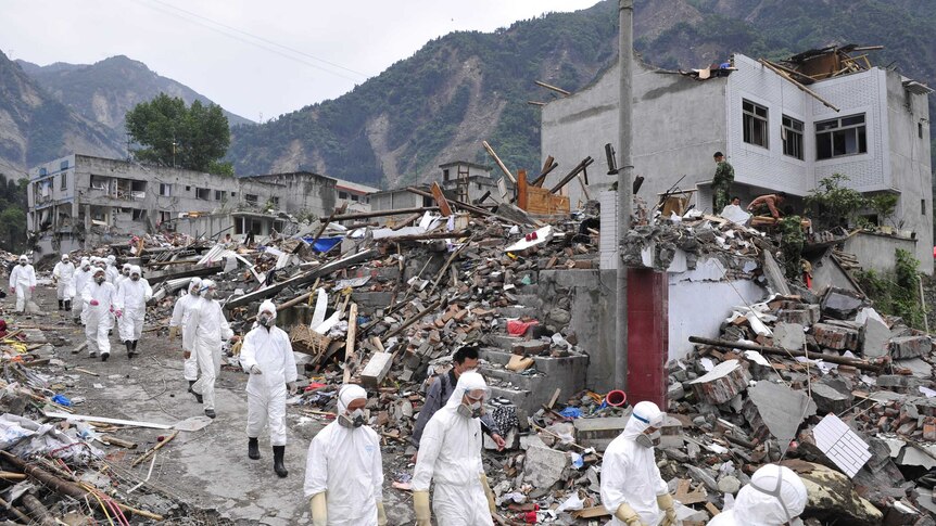 Soldiers in protective suits patrol Yingxiu after 2008 earthquake