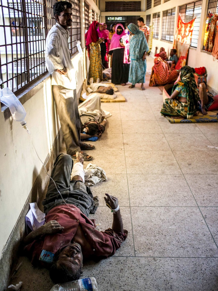 Bangladeshi survivors of the collapse of a partly-built cement factory