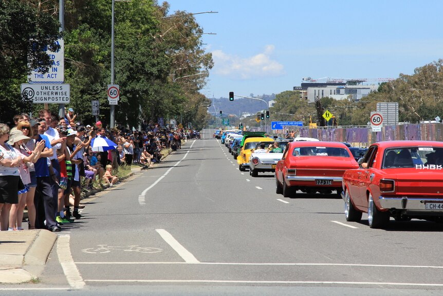 Summernats cars drive down Northbourne Avenue for the annual city cruise.