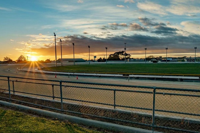 A sunrise over a race track