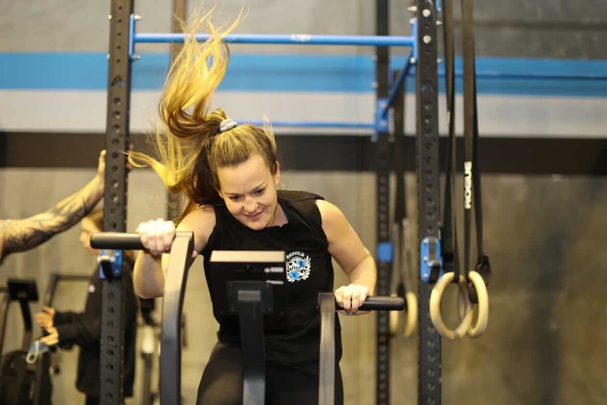 Woman smiling on airbike