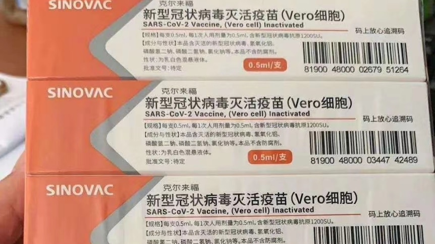 Some boxes of Chinese COVID-19 vaccines on a desk.