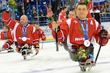 Russia's Sledge Hockey team players show their silver medals.