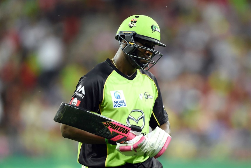 Sydney Thunder's Andre Russell loses his wicket in BBL match against Sydney Sixers.