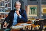 An oil painting of Kevin Rudd in his Queensland home, a cat wanders on the table in front of him, a wall of books behind him.