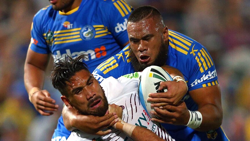 Manly's Jesse Sene-Lefao is tackled by Parramatta's Isaac De Gois and Junior Paulo.