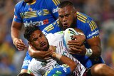 Manly's Jesse Sene-Lefao is tackled by Parramatta's Isaac De Gois and Junior Paulo.