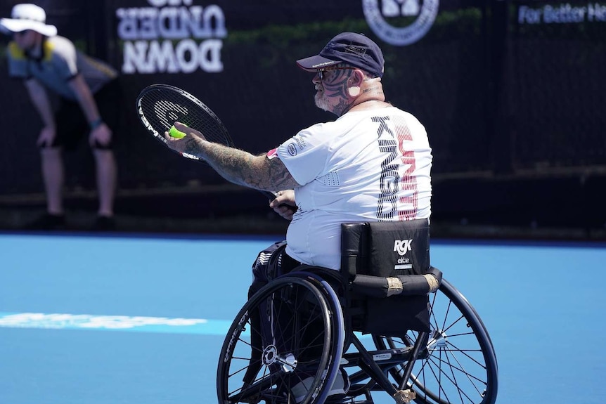 Paul Guest serves during his match on the final day of the wheelchair tennis event at the 2018 Invictus Games.
