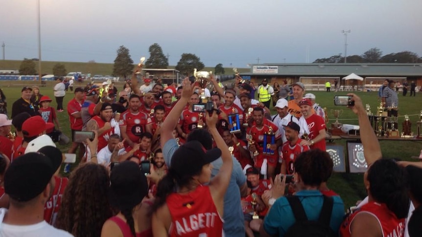 Walgett Aboriginal Connection celebrating after winning the 44th Koori Knockout at Raymond Terrace.