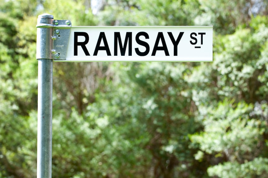 A street sign saying 'Ramsay Street'.