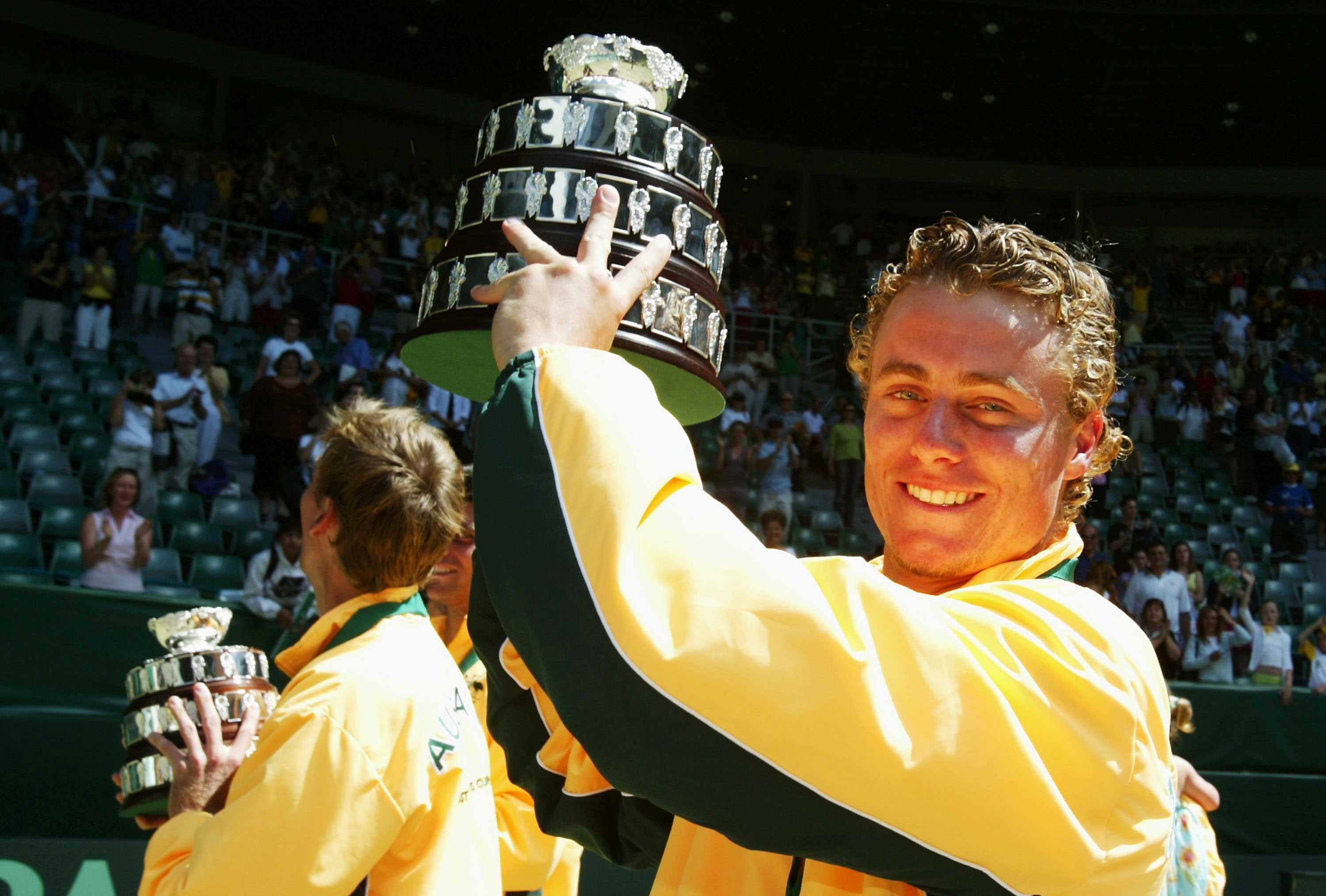 Lleyton Hewitt holds his Davis Cup replica after Australia's win over Spain in the 2003 final.