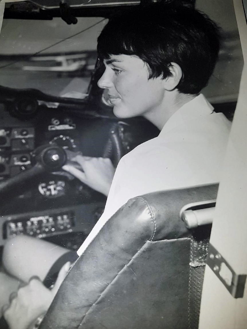 Old photo of woman in a cockpit