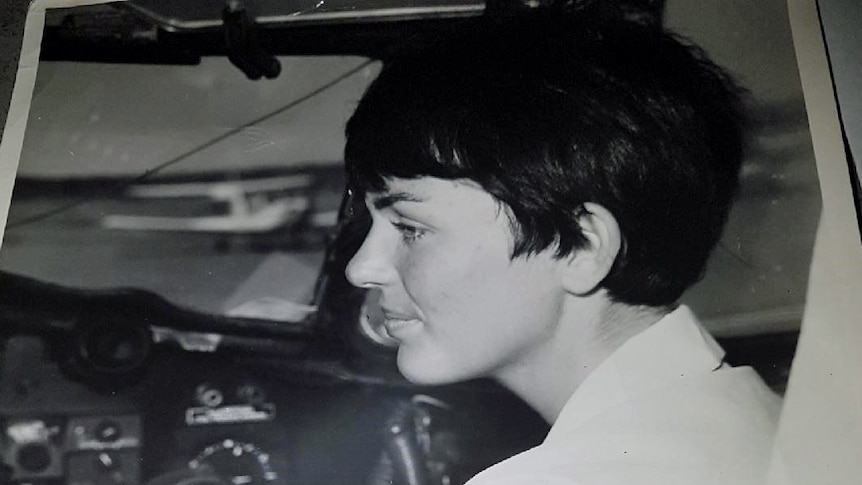 Old photo of woman in a cockpit