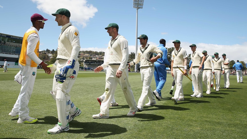 Teams shake hands after Australia's win over West Indies