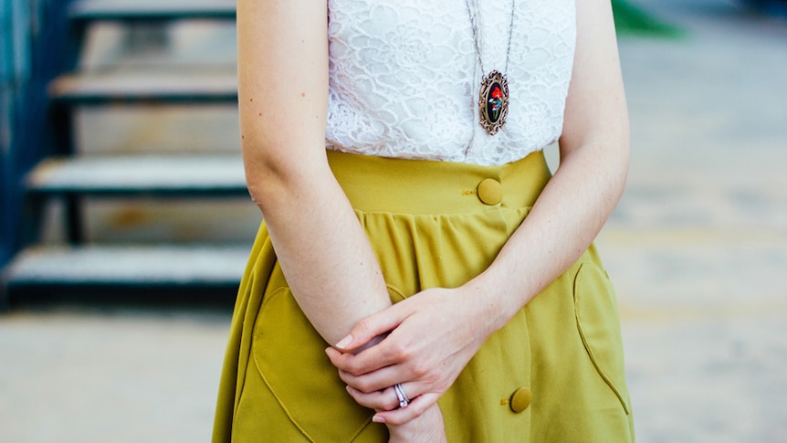 A woman in a yellow skirt.