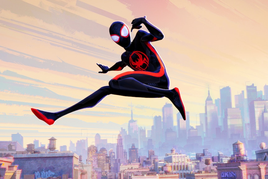 Spider-Man, an animated figure in a skin-tight blue and red body suit leaps through the air against a cityscape.
