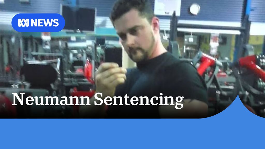 Neumann Sentencing: A man taking a photo of himself in a mirror at a gym.