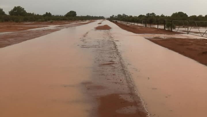 Parched land near Cobar NSW covered in puddles after heavy rain.