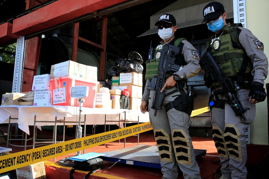 PDEA officers guard confiscated drugs in Trece Martires, Cavite, south of Manila.