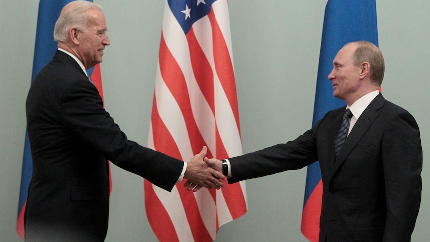 US president Biden shakes Russian President Putin's hand at a meeting in Moscow in 2011