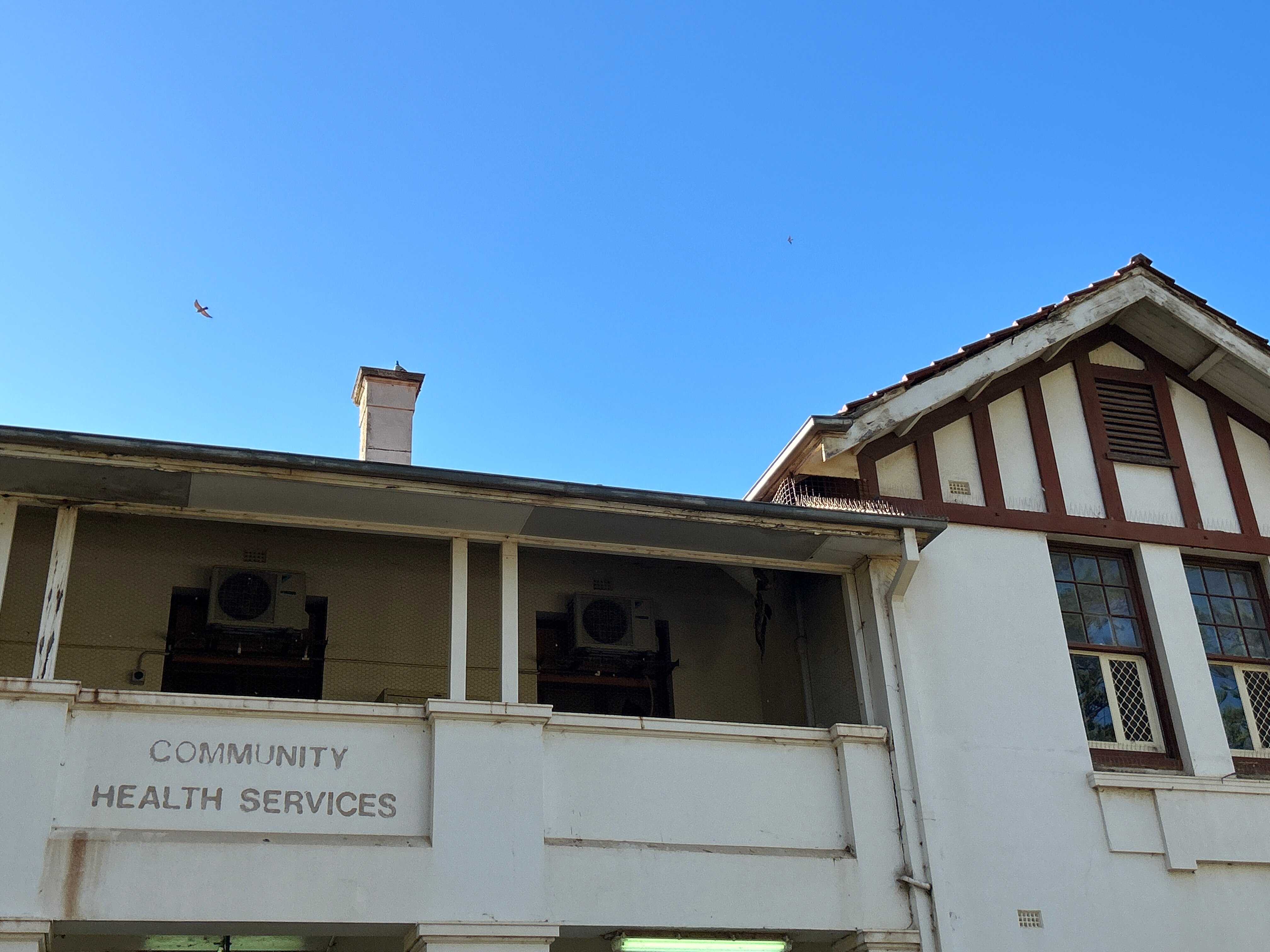 A building with blue skies behind.