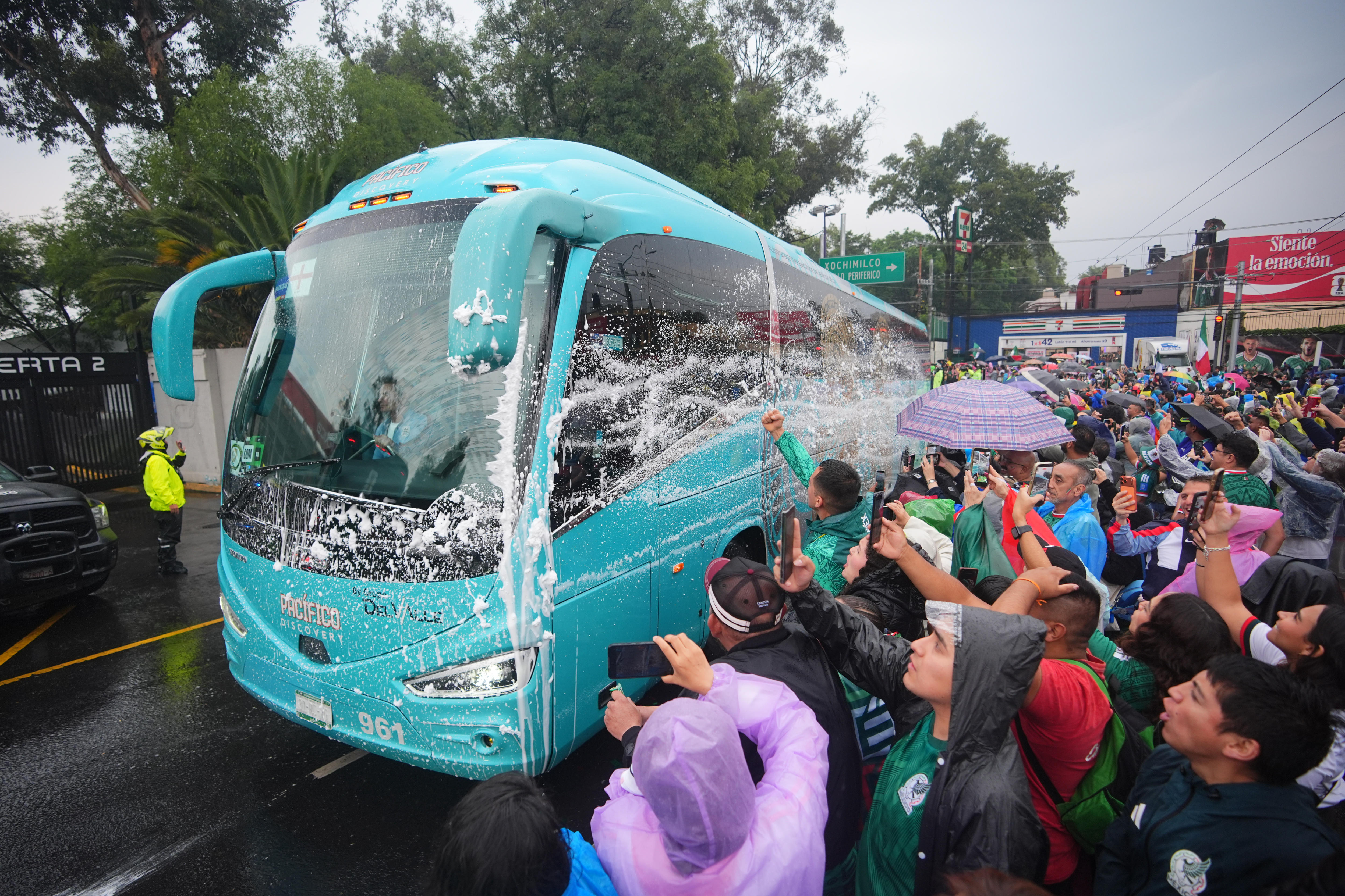 England's team bus is soaked in liquid by Mexico fans upon arrival at the stadium