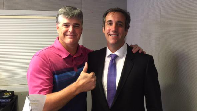 Sean Hannity (left) gives a thumbs up beside lawyer Michael Cohen.