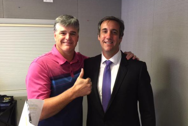 Sean Hannity (left) gives a thumbs up beside lawyer Michael Cohen.