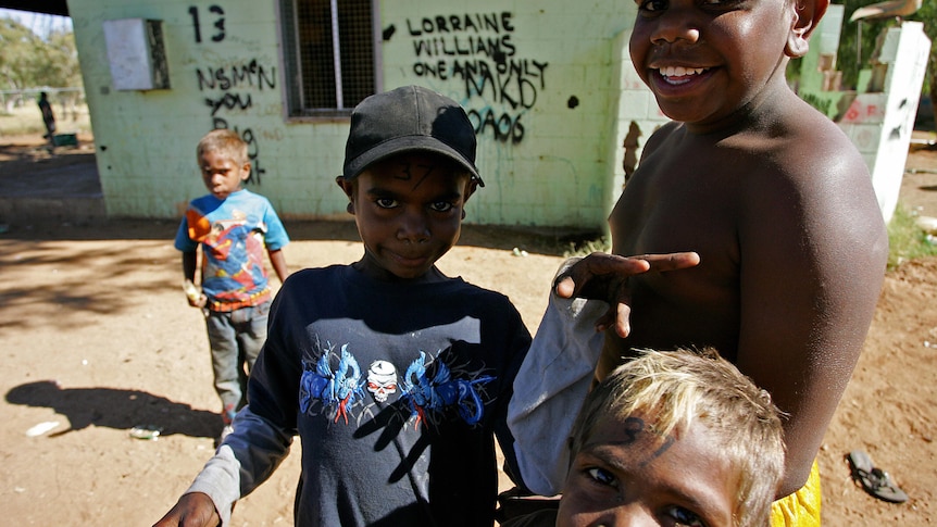 smiling children with no shirts on 