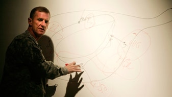 General Stanley McChrystal speaks to the military at the US base Kandahar Airfield December 2, 2009 (Getty Images: Mustafa Qu...