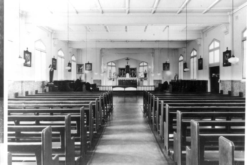 Black and white image of the inside of the chapel at St Joseph's orphanage