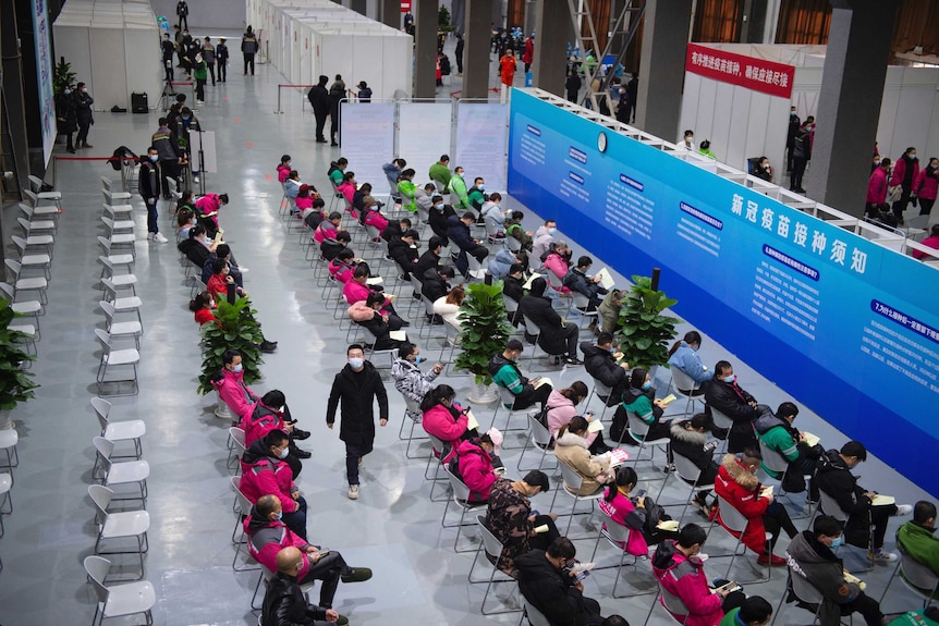 People waiting for taking COVID-19 vaccines in Beijing.