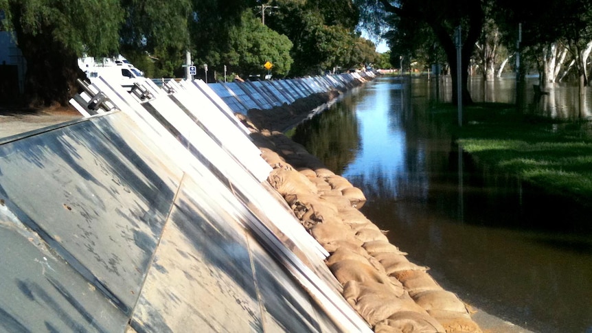 Floodwaters lap at the levee in the town of Nathalia.