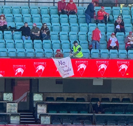 Live: Security removes banner as Swans men's and women's teams take the field