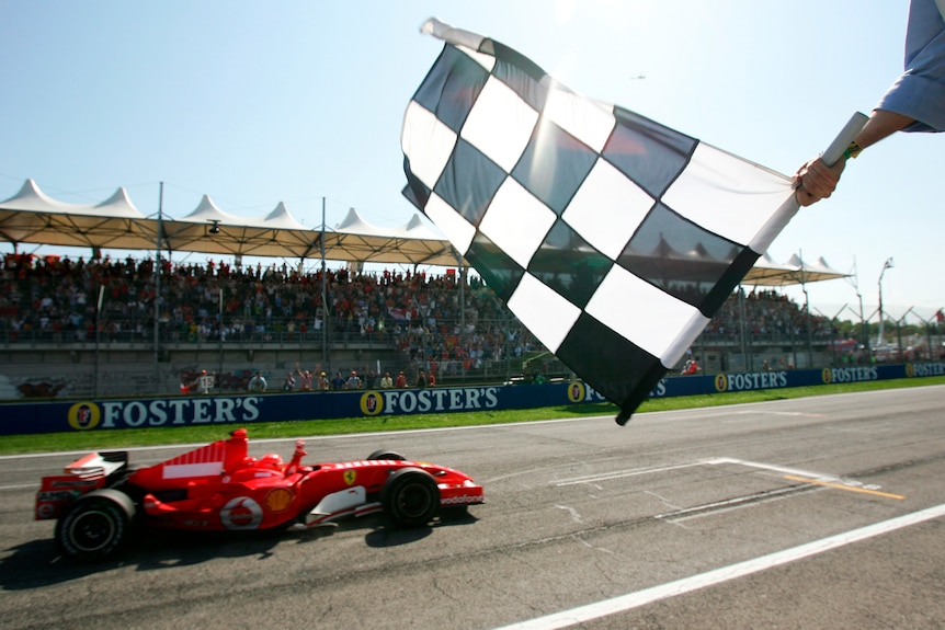 Michael Schumacher of Germany crosses the finish line.