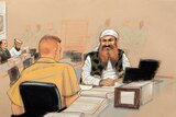 Khalid Sheikh Mohammed, (R), the alleged mastermind of the September 11 attacks, speaks with his defence lawyer