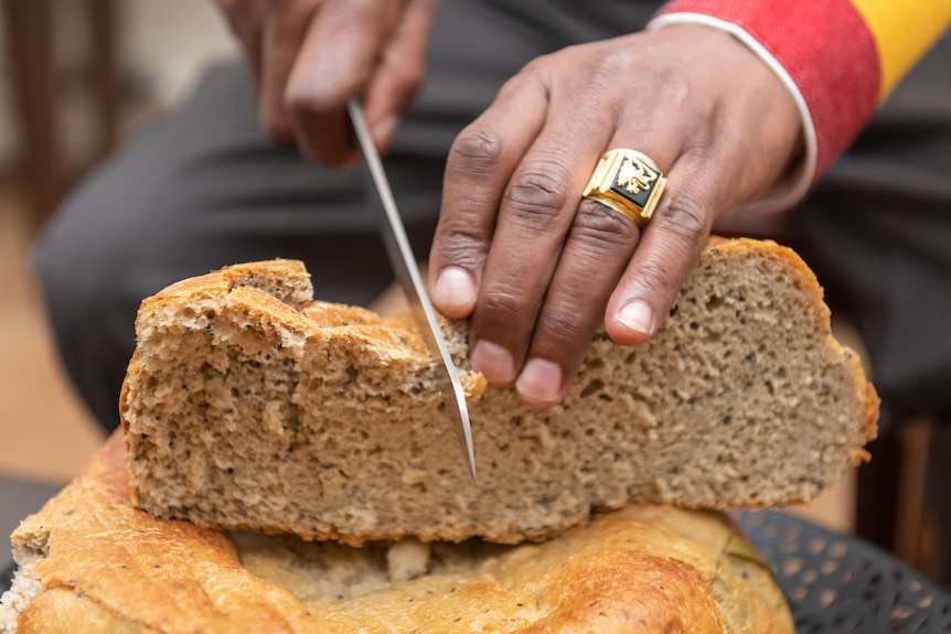 Traditional Ethiopian bread being sliced.