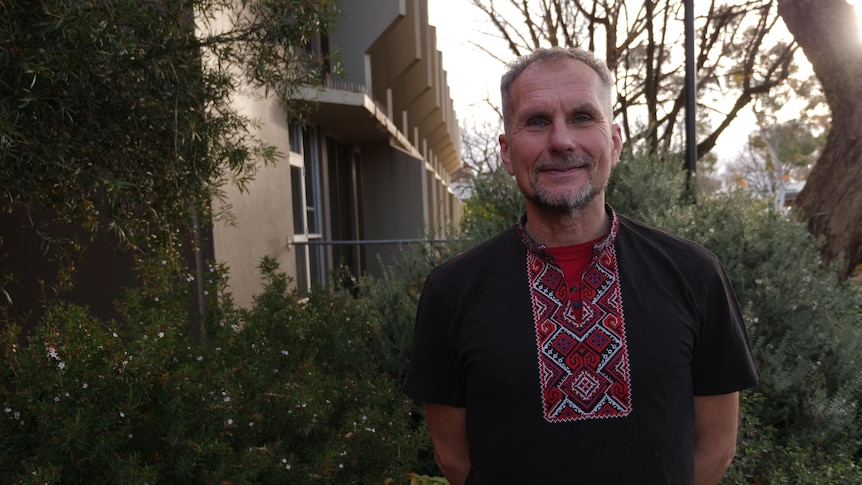 A middle aged man in traditional Ukrainian dress 