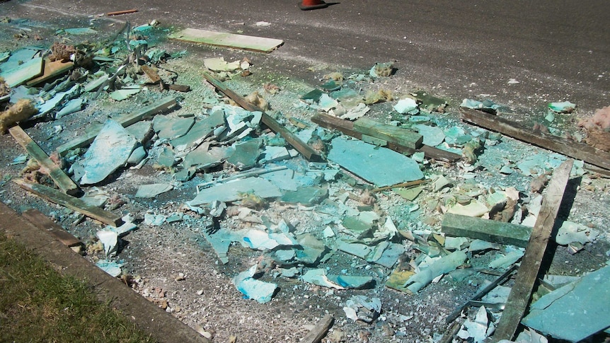 Building materials lie strewn across Boundary Road at Chester Hill.